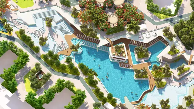 Aerial view of the lagoon-style pool and landscaped decks at Elan The Emperor