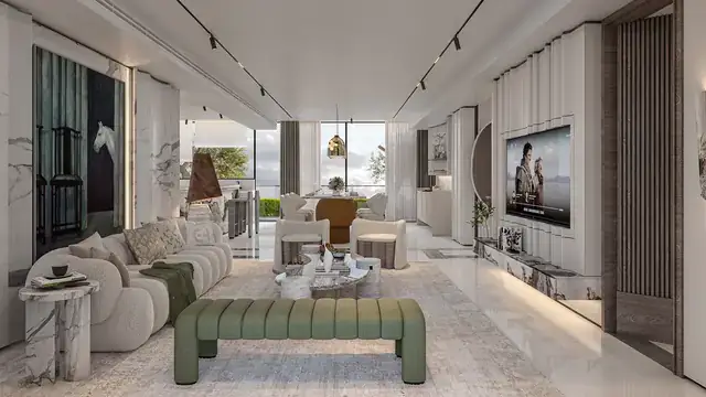 Long living room with marble finishes at Elan The Emperor