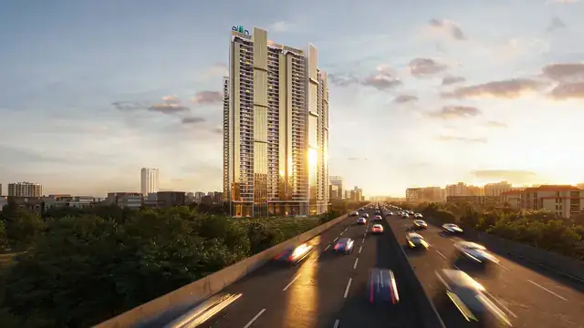 Elan The Statement tower rising beside the expressway at sunset, Sector 49 Gurgaon