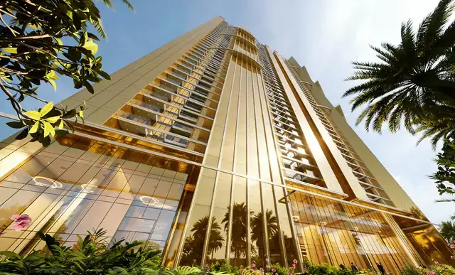 Looking up the golden glass façade of Elan The Statement